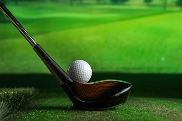 Sreen Golf Putter And Golf Ball On The Background Of